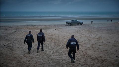 French police patrol the beach of Wimereux searching for migrants on November 25, 2021 in Calais, France
