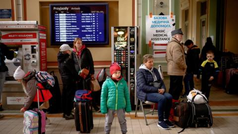 Ukrainian refugees waiting for a train in Poland in April