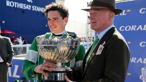 Winning jockey Danny Mullins and trainer Willie Mullins with the tropjy after Macdermott won the Scottish Grand National at Ayr