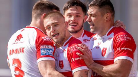 Rugby League - Betfred Super League Round 6 - Hull KR v Hull FC - Sewell Group Craven Park, Hull, England - HUll KR's Mikey Lewis (c) is congratulated by Tom Opacic, Niall Evalds & Ryan Hall after scoring a try against Hull FC.