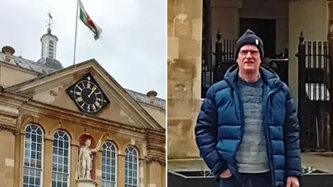 A Welsh flag flying above Shire Hall in Monmouth and Peter Williams