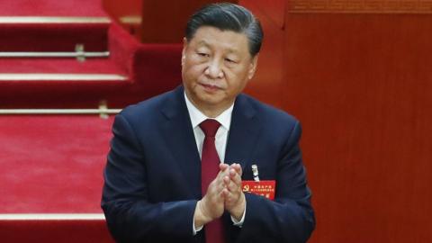 Chinese President Xi Jinping claps during the opening ceremony of the 20th National Congress of the Communist Party of China.