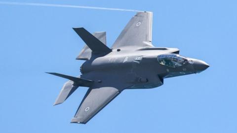 An Israeli Air Force F-35 Lightning II fighter aircraft flies over during an air show in Tel Aviv on 26 April 2023