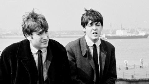 John Lennon and Paul McCartney by the River Mersey