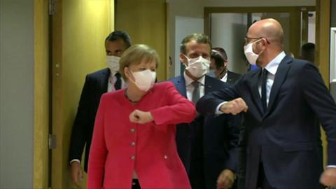 German Chancellor Angela Merkel bumps elbows with EU Council leader Charles Michel