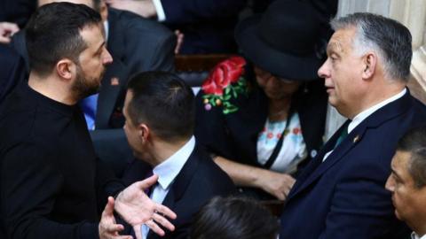 Hungarian Prime Minister Viktor Orban speaks with Ukraine's President Volodymyr Zelenskiy at the National Congress, in Buenos Aires, Argentina December 10, 2023