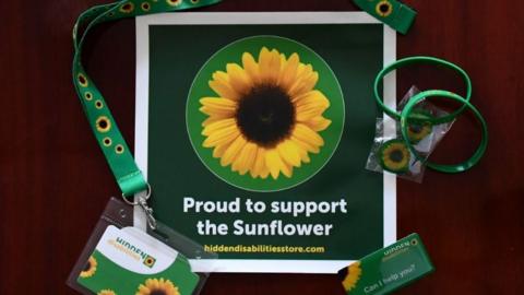 The sunflower lanyard, pins and wrist bands
