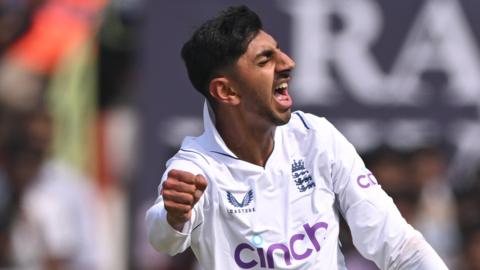 England's Shoaib Bashir celebrates the wicket of India's Rohit Sharma on day one of the second Test in Visakhapatnam