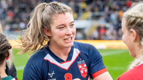 Vicky Molyneux embraces a Wales opponent after England's November Test win