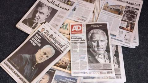 Dutch newspapers with pictures of crime journalist Peter de Vries, who died on 15 July 2021 after being shot as he left a television studio.