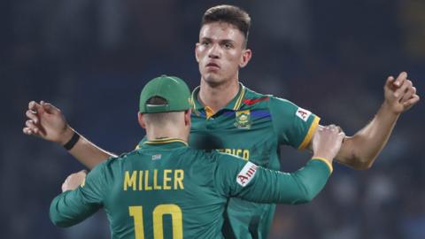 South Africa bowler Marco Jansen celebrates taking a wicket with team-mate David Miller