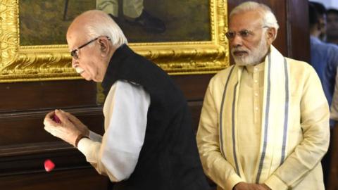 Prime Minister Narendra Modi (R) and Senior BJP leader L K Advani pay tribute at Parliament House on July 6, 2018 in New Delhi.