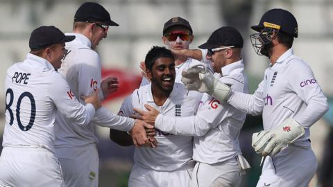 England celebrating one of Rehan Ahmed's wickets