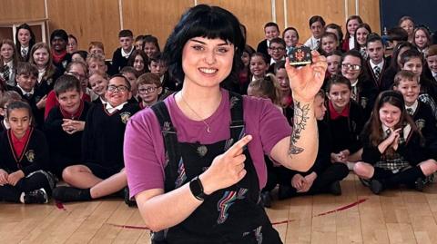Blue Peter presenter Abby Cook demonstrated some of the micro:bit's features during the school assembly in Scotland.