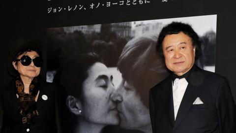 Yoko Ono and photographer Kishin Shinoyama pose at the Kishin Shinoyama Photo Exhibition held.