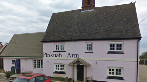 Exterior of pink pub called the Pinkhuah Arms.