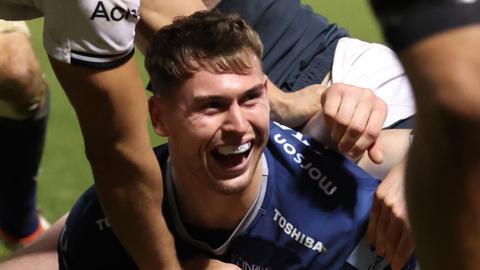 Tom Roebuck goes over for Sale Sharks' second try against Saracens at AJ Bell Stadium