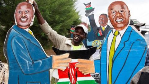 vendor holds an artistic expression representing Kenya"s President-elect William Ruto and his deputy Rigathi Gachagua outside his official residence in Karen district of Nairobi, Kenya, August 17, 2022.