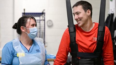 Luke Louden on the ZeroG Gait and Balance System, as physiotherapist Claire Lincoln looks on