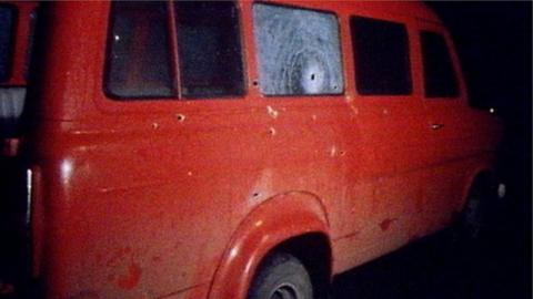 Minibus with bullet holes
