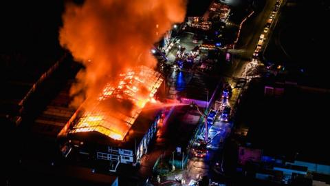 Aerial view of warehouse on fire