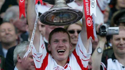 Cormac McAnallen captained Tyrone to minor and Under-21 All-Ireland titles and played on the county's Sam Maguire Cup winning team in 2003 before being appointed senior skipper