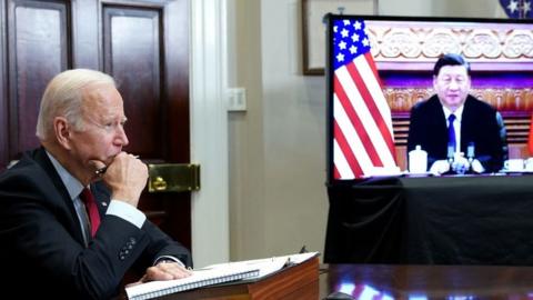 US President Joe Biden meets with China's President Xi Jinping during a virtual summit in 2021