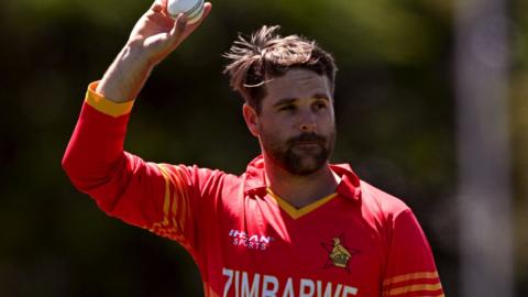 Zimbabwe spinner Ryan Burl celebrates his fiver-for against Australia