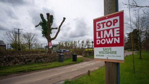 Image of a red Stop Lime Down sign