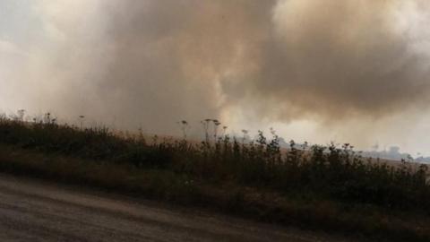 Fire outside entrance of Wroxham Barns