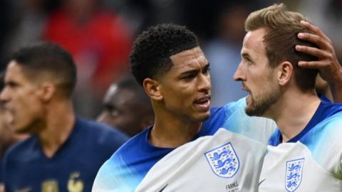 Jude Bellingham consoles Harry Kane after his 2022 World Cup penalty miss for England against France