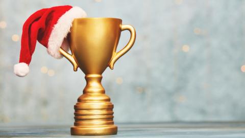 Trophy with a Christmas hat on