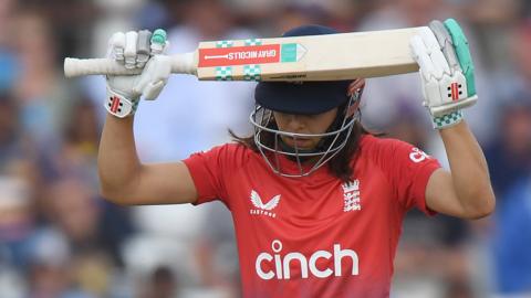 England's Maia Bouchier with her bat on her head after she is dismissed against Sri Lanka