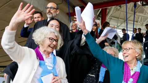 Activists of Climate Seniors from Switzerland celebrate as they leave the European Court of Human Rights (ECHR), after the judgement in a case against different European countries accused of climate inaction at the European court of Human Rights in Strasbourg, France, on 9 April 2024