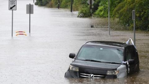 Car submerged in flood waters