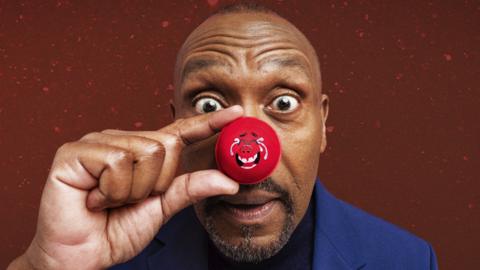 Sir Lenny Henry wearing a red nose