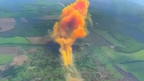 Cloud of orange smoke after farm is hit