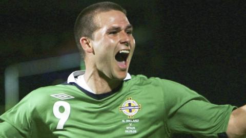 David Healy celebrates coring against Spain in the 3-2 win at Windsor Park in 2006