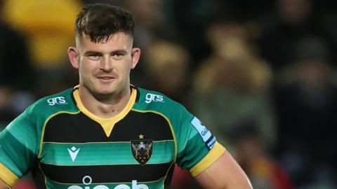 Sam Graham with a wry smile while playing for Northampton