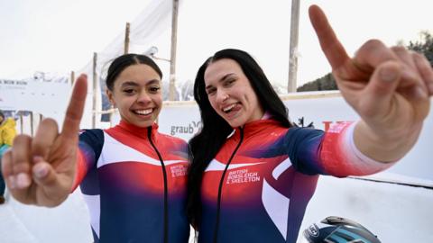 Great Britain bobsledders Kya Placide & Adele Nicoll celebrate gold