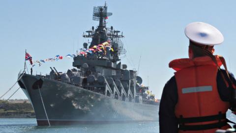 Sailor looks at Russian missile cruiser
