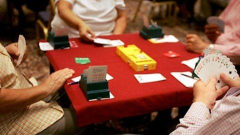 Image of card game being played.