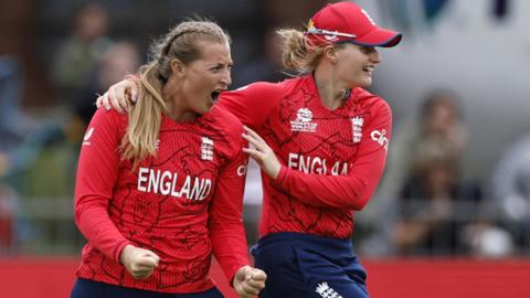 Sophie Ecclestone (L) and Charlie Dean celebrate a wicket for England v India
