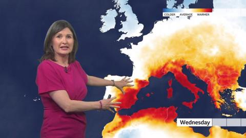 Helen Willetts stands in front of a weather map of Europe