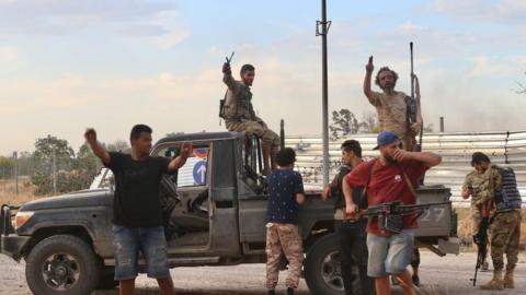 Members of Libyan army celebrate after recapturing Tripoli airport from warlord Khalifa Haftar's militias in Tripoli, Libya on June 03, 2020.