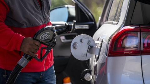A customer pumps gas at a gas station in Hercules, California, US, on Thursday, March 14, 2024.