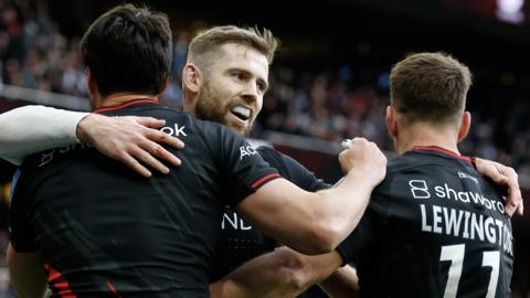 Saracens players celebrate after Sean Maitland scores a try