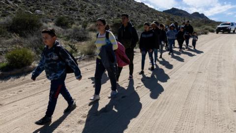 Migrants at the border in February 2024