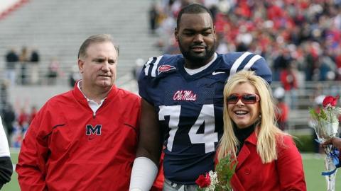 Michael Oher with Sean and Leigh Anne Tuohy in 2008