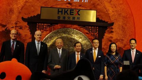 Alibaba chairman Daniel Zhang in the centre of a picture of Alibaba executives and Chinese officials at the Hong Kong stock exchange
